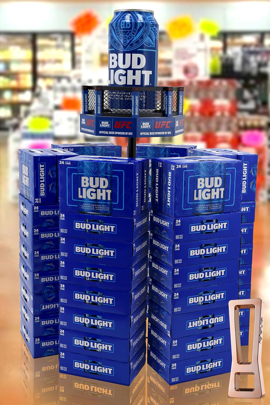 Stack of Bud Light 24-pack boxes forming a display, with a large Bud Light can perched on top in a store aisle.