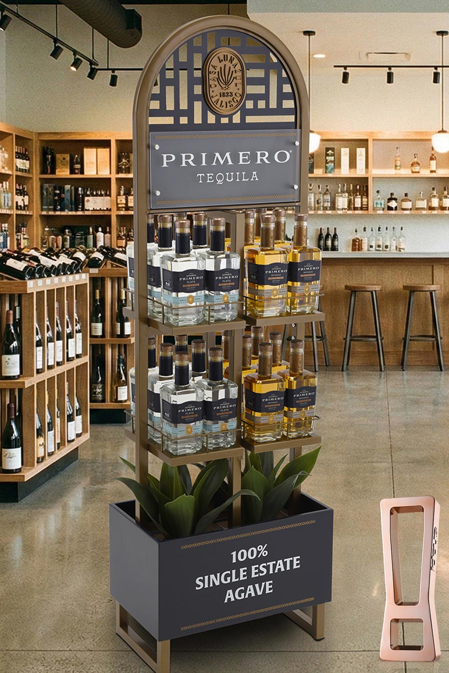 Store display featuring Primero Tequila bottles on a tiered stand with a curved arch sign and a planter box reading '100% SINGLE ESTATE AGAVE' in a liquor shop setting